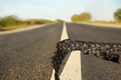 Large crack on asphalt road after earthquake