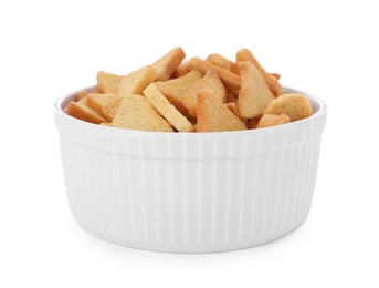 Delicious crispy rusks in bowl on white background