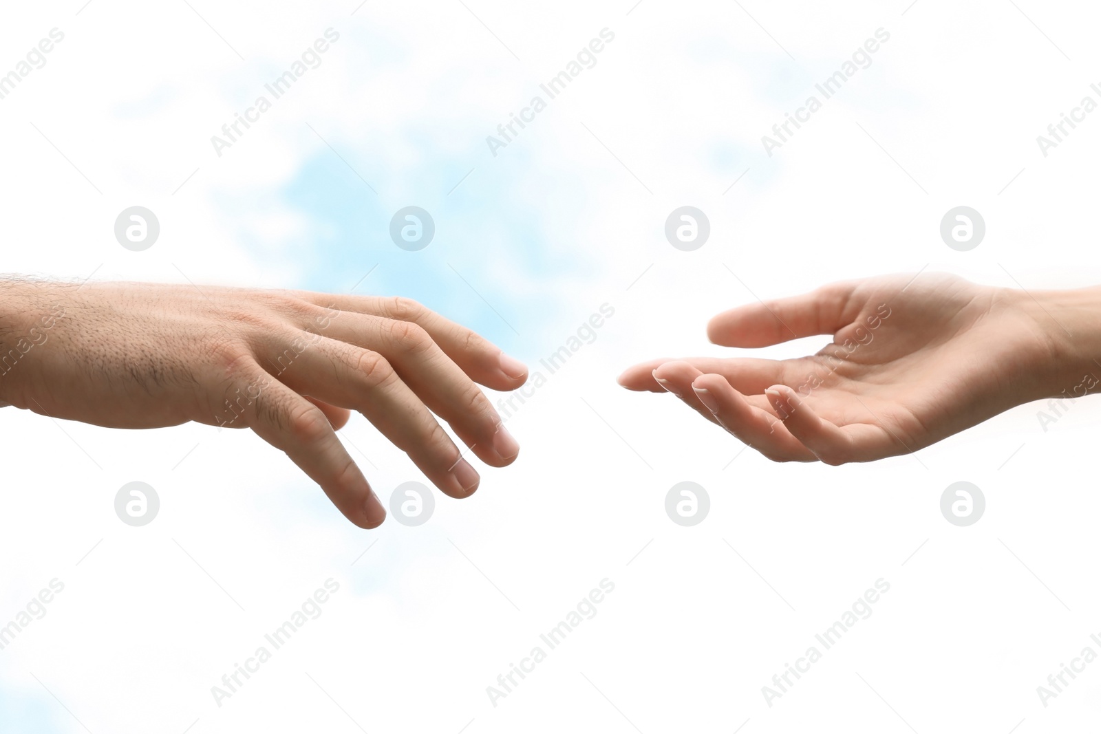 Photo of Man and woman giving each other hands on blurred background. Concept of support and help