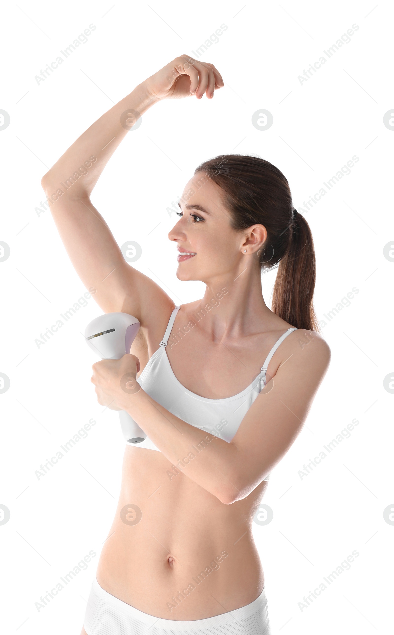 Photo of Smiling young woman doing armpit epilation procedure on white background