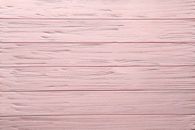 Texture of pink wooden surface as background, top view