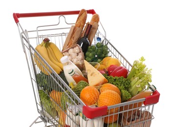 Shopping cart full of groceries on white background