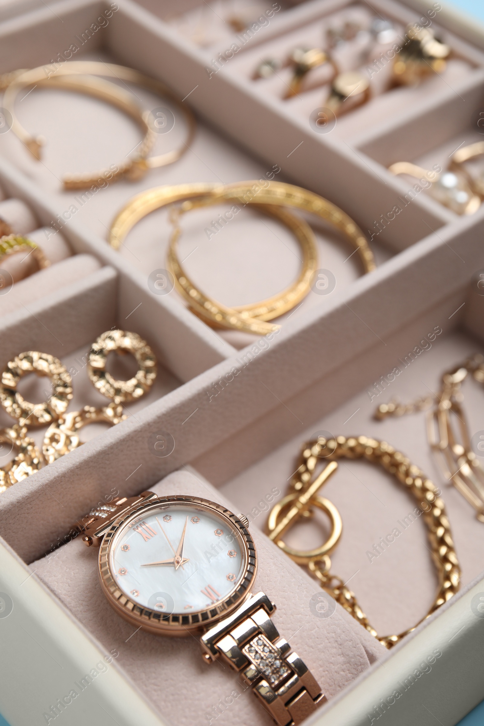 Photo of Jewelry box with stylish golden bijouterie, closeup view