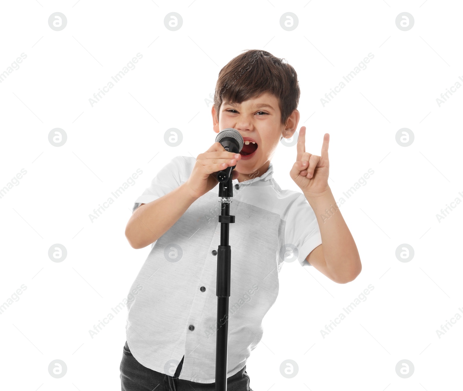 Photo of Cute little boy singing into microphone on white background