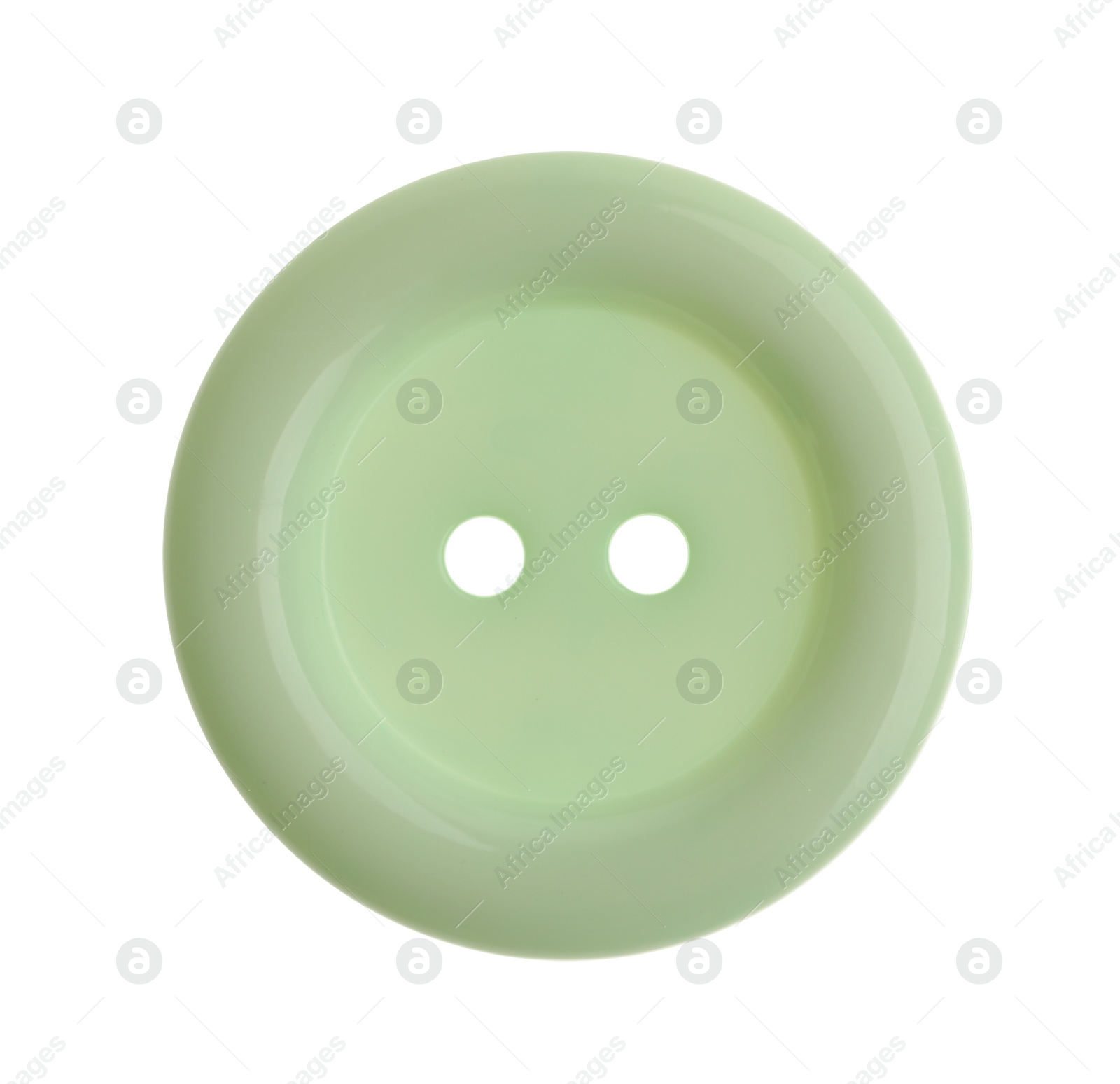 Photo of Light green plastic sewing button isolated on white