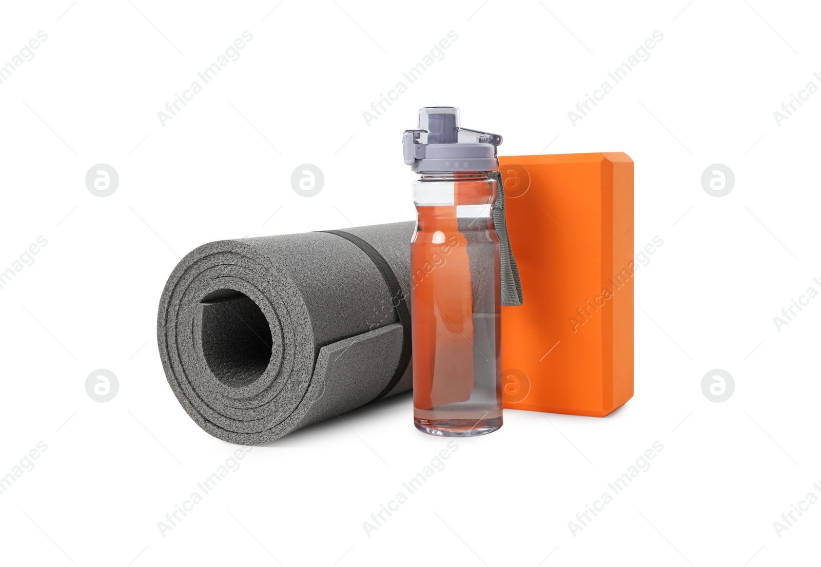 Photo of Grey exercise mat, yoga block and bottle of water isolated on white