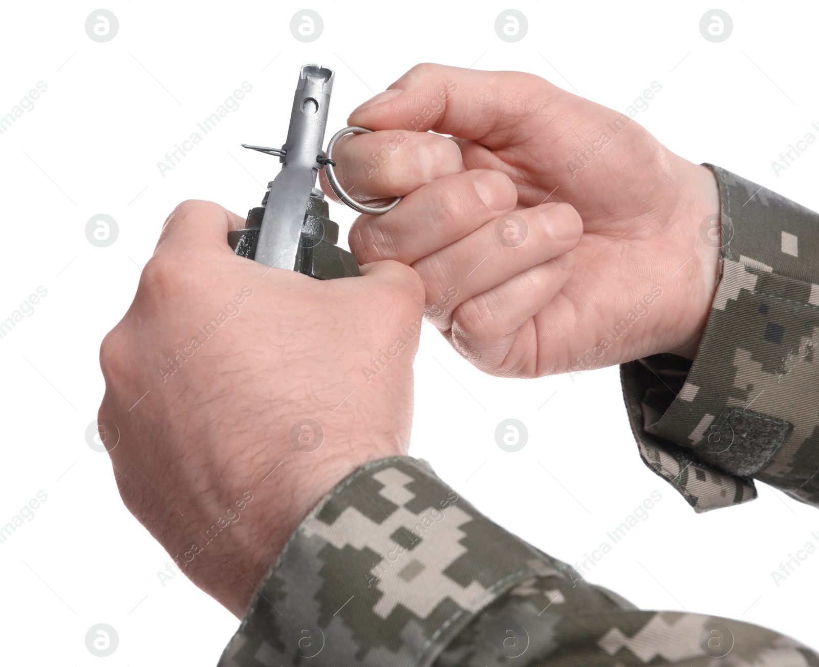 Photo of Soldier pulling safety pin out of hand grenade on white background, closeup. Military service