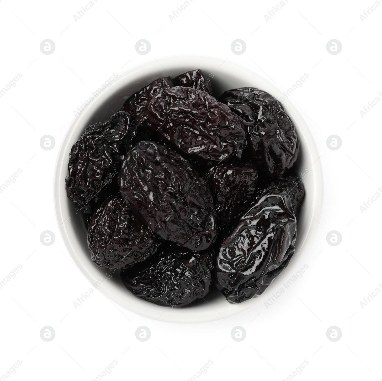 Photo of Bowl with sweet dried prunes isolated on white, top view