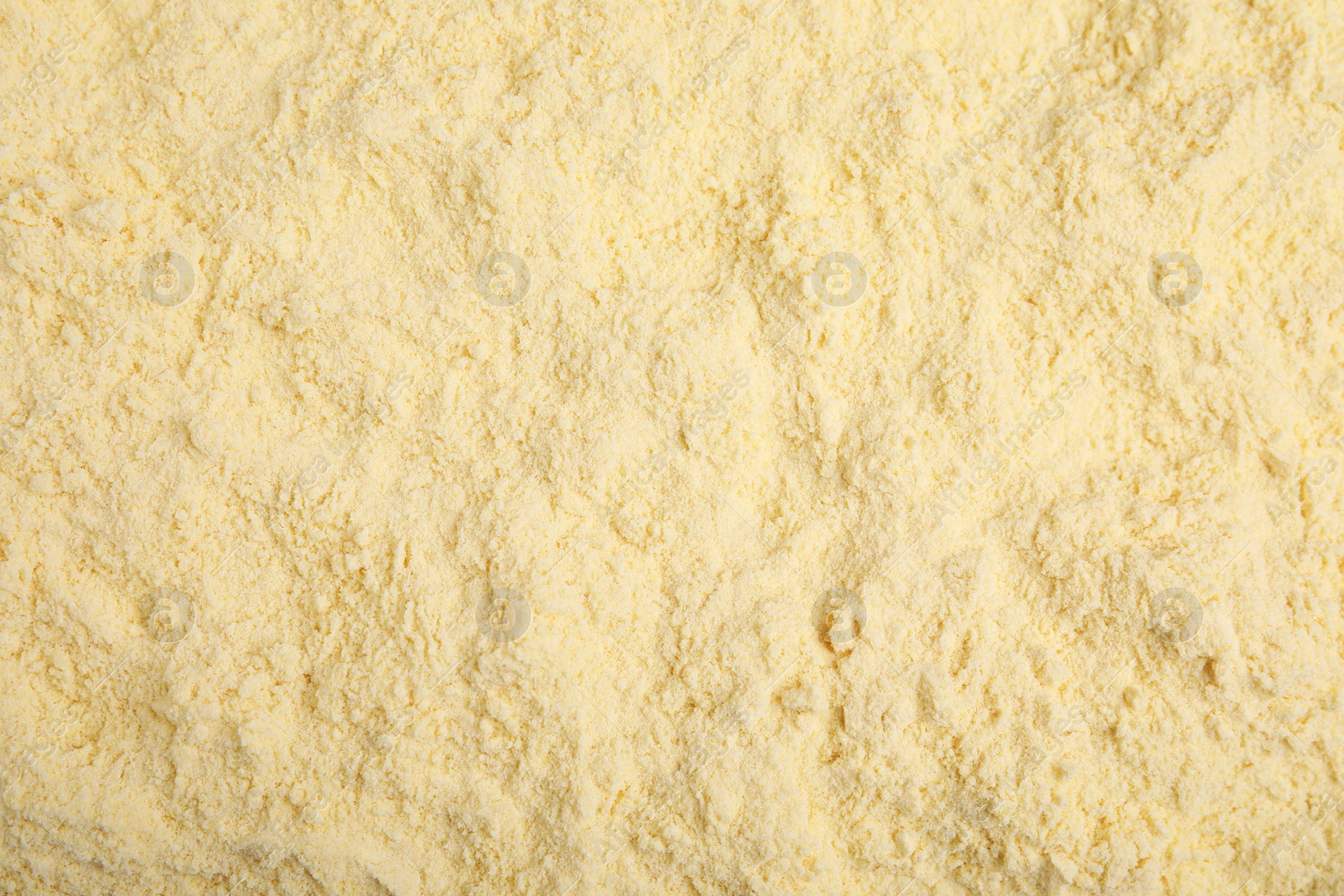 Photo of Pile of corn flour as background, top view