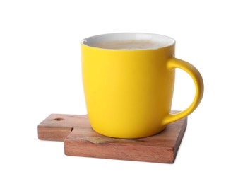 Photo of Mug of coffee and stylish wooden cup coaster isolated on white