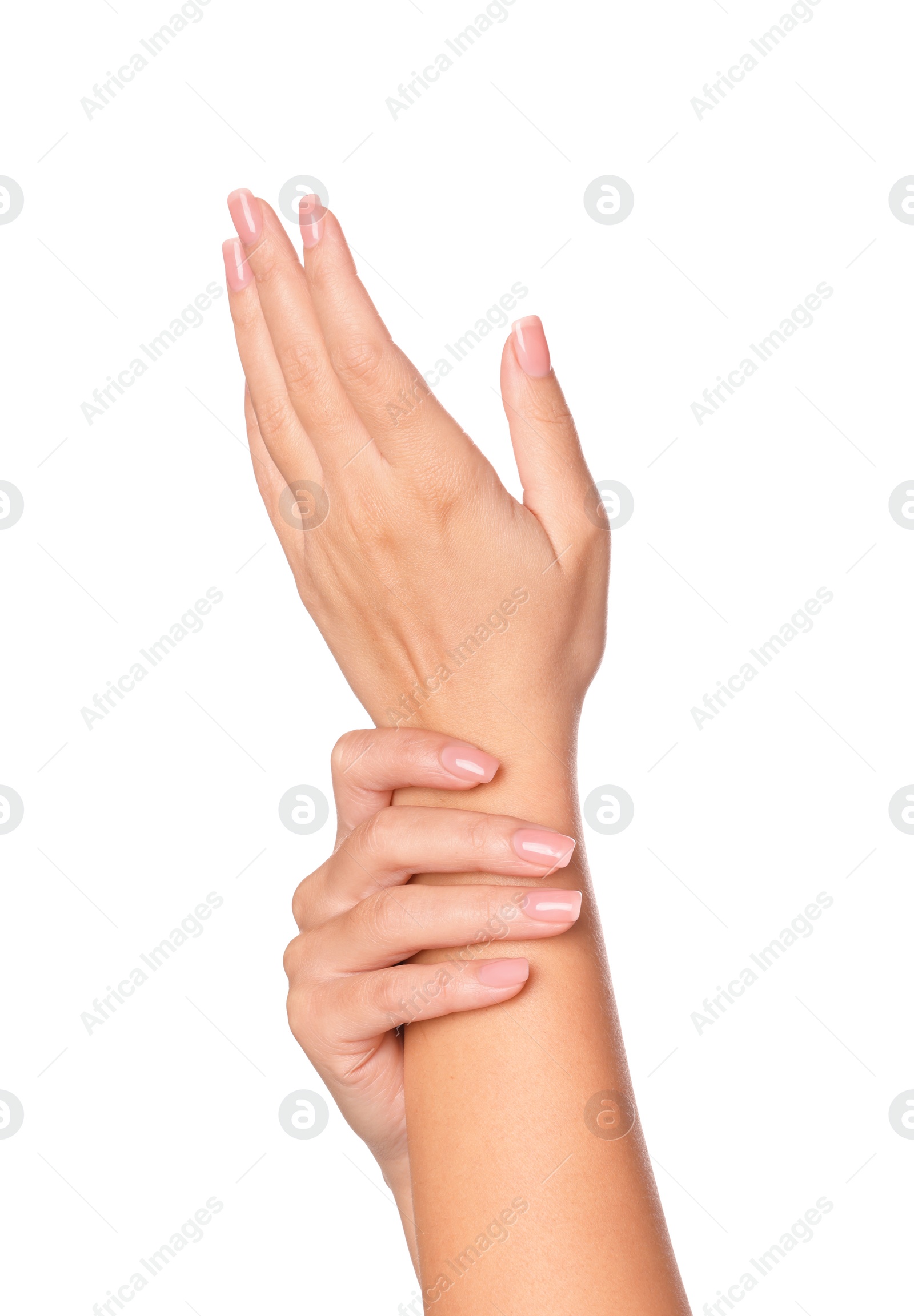 Photo of Woman showing hands with nude manicure on white background, closeup
