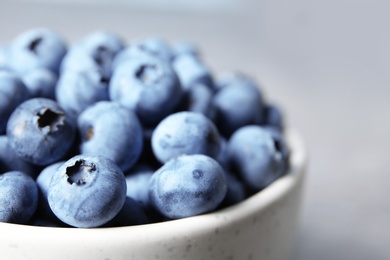 Crockery with juicy and fresh blueberries, closeup