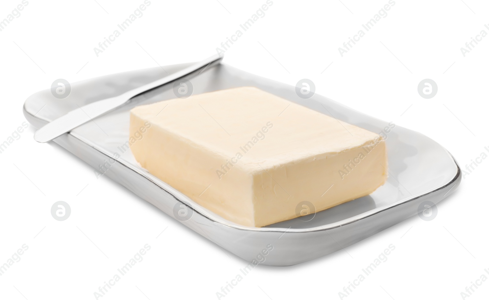 Photo of Plate with tasty fresh butter and knife on white background