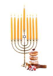 Photo of Hanukkah celebration. Menorah with candles, gift boxes and donuts isolated on white