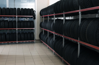 Photo of Car tires on rack in auto store