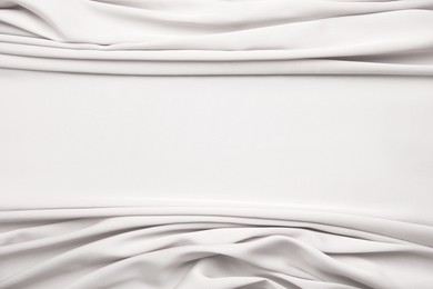 Texture of delicate white silk as background, top view