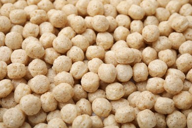 Photo of Tasty sweet cereal balls as background, closeup