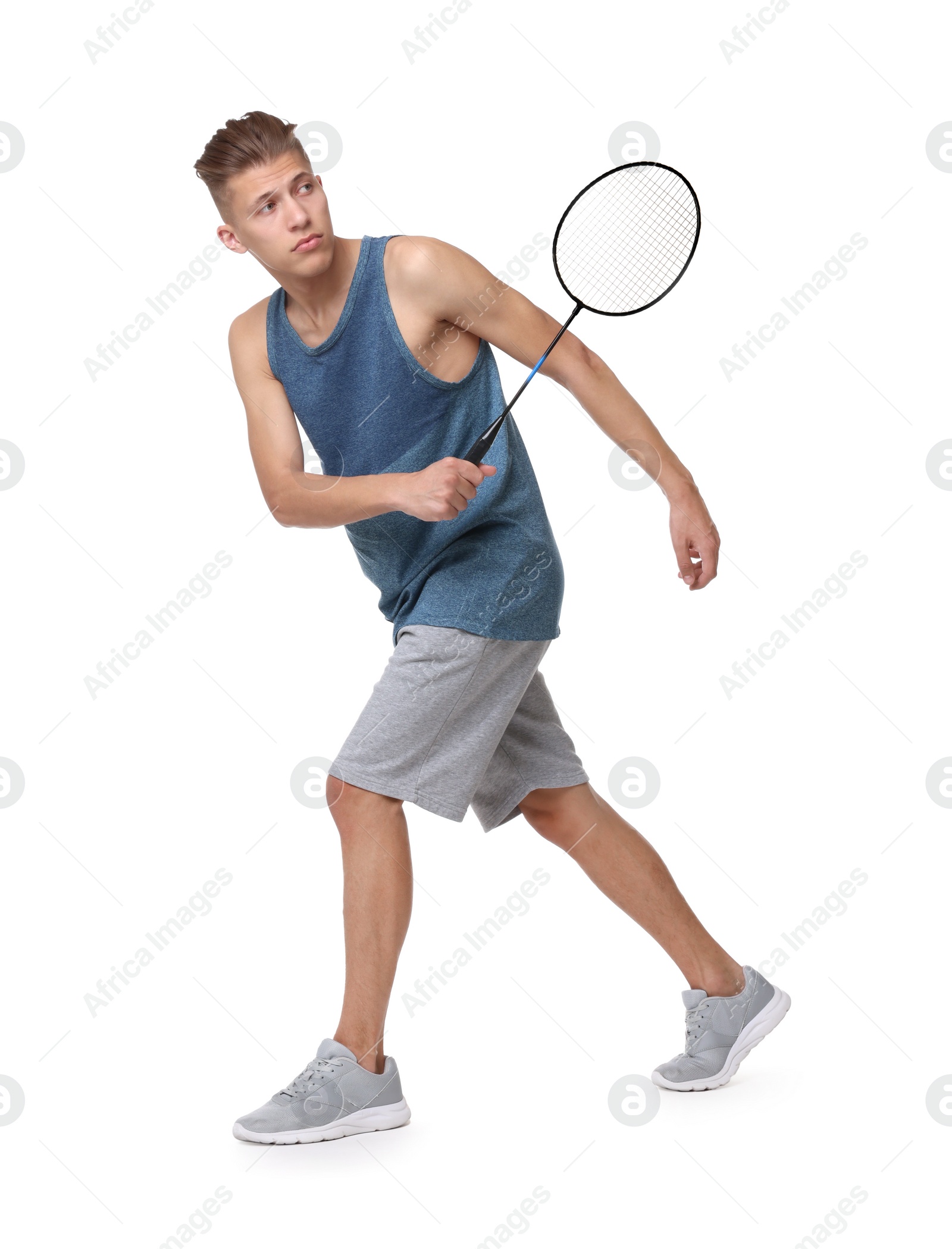 Photo of Young man playing badminton with racket on white background