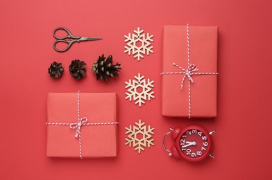 Flat lay composition with Christmas gifts on red background. Boxing day