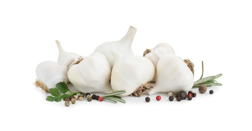Photo of Fresh garlic bulbs, peppercorns and herbs isolated on white