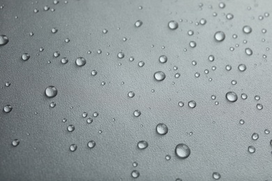 Photo of Many clean water drops on grey background