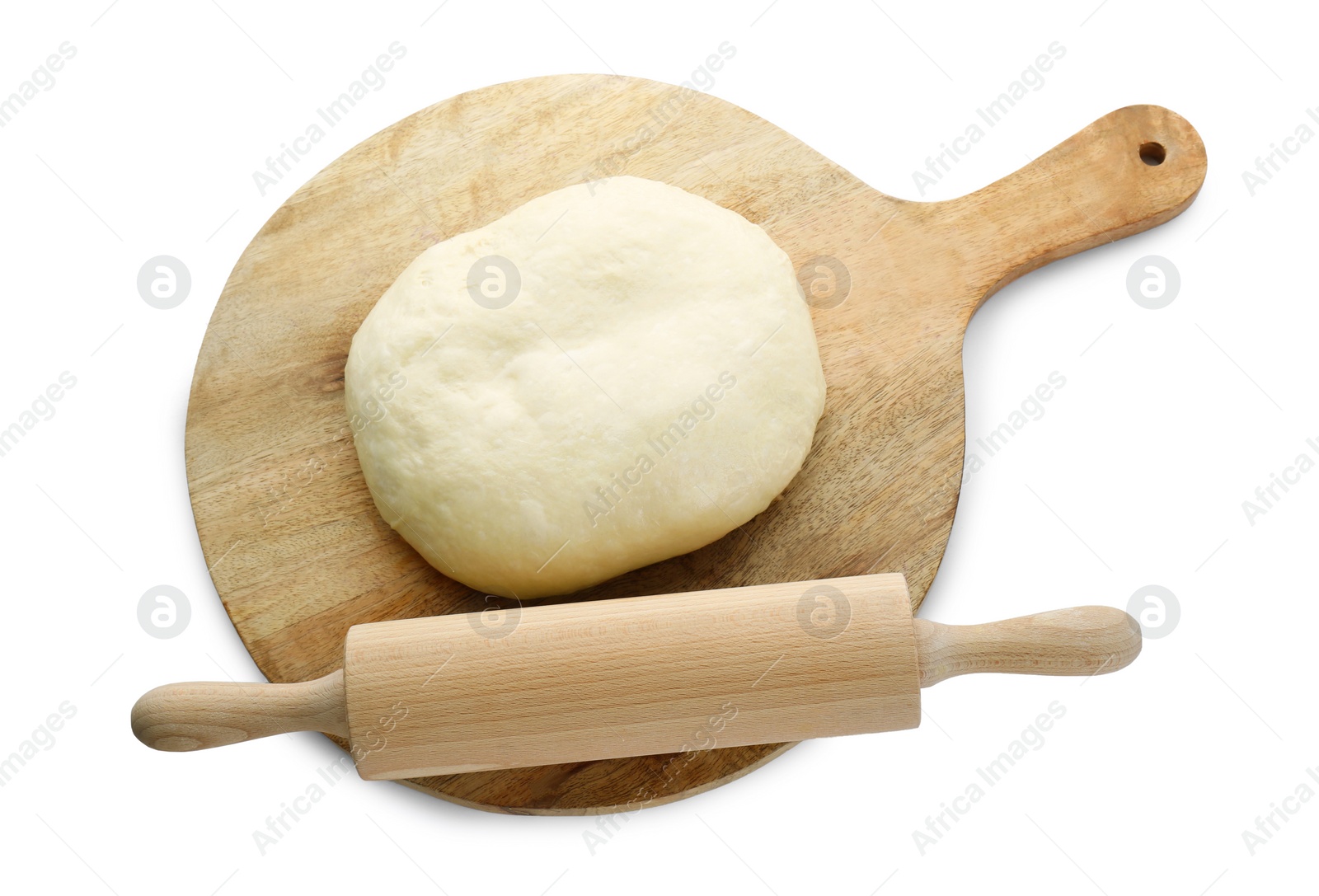 Photo of Fresh yeast dough and wooden rolling pin isolated on white, top view