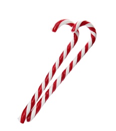 Photo of Tasty candy canes on white background. Festive treat