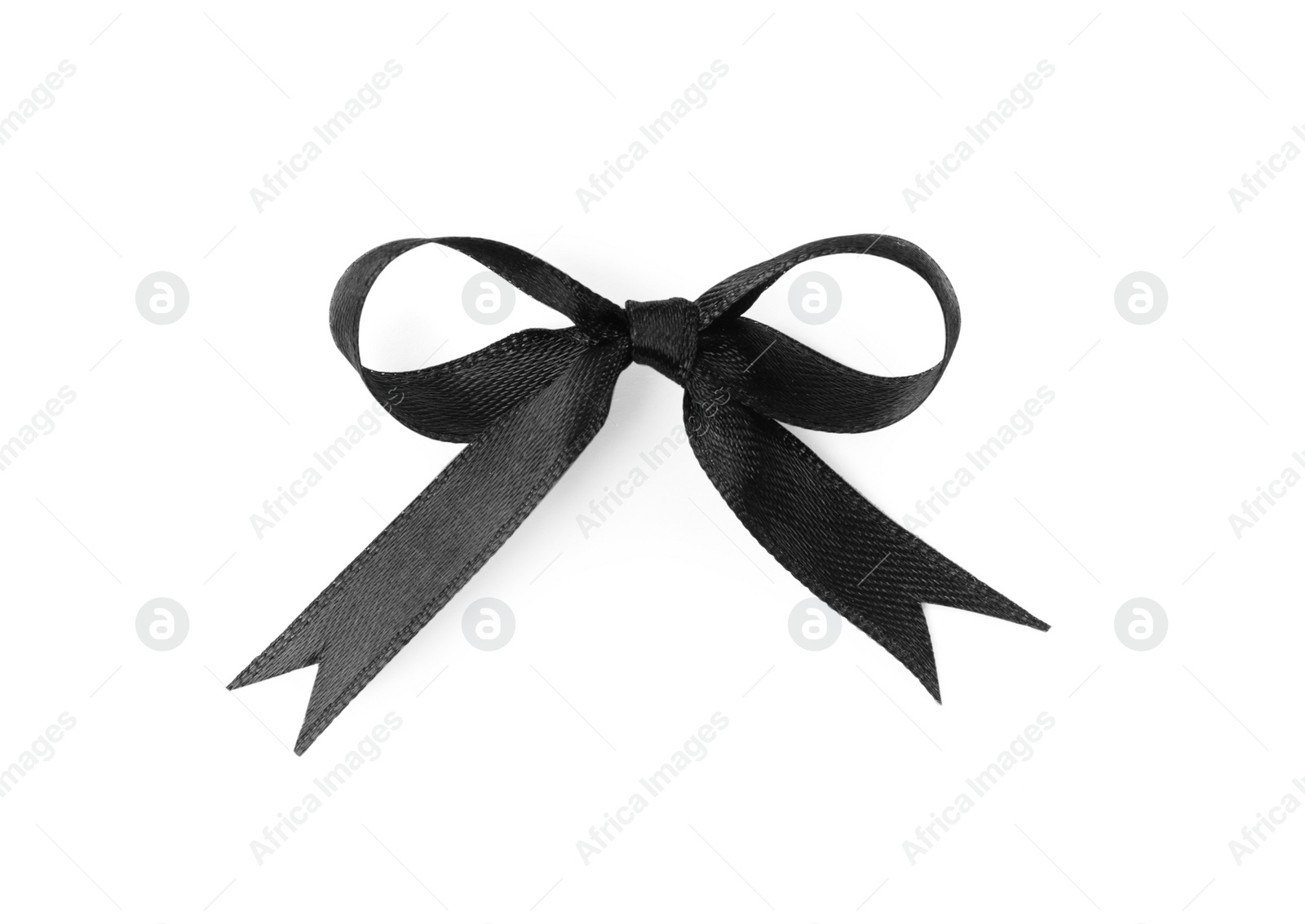 Photo of Elegant black ribbon tied in bow isolated on white, top view