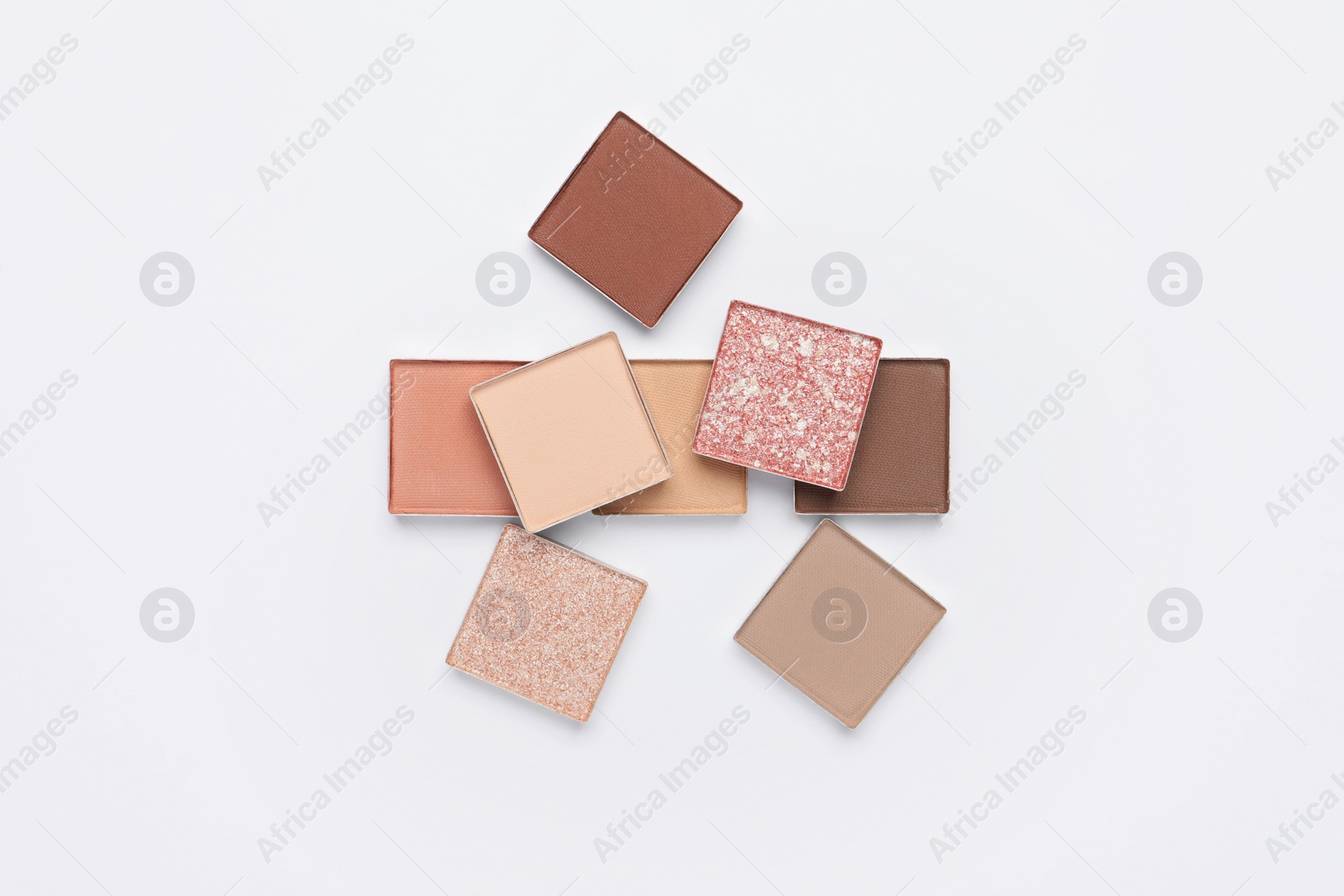 Photo of Different beautiful eye shadows on white background, flat lay