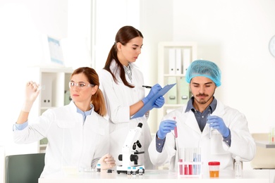 Scientists working in laboratory. Research and analysis