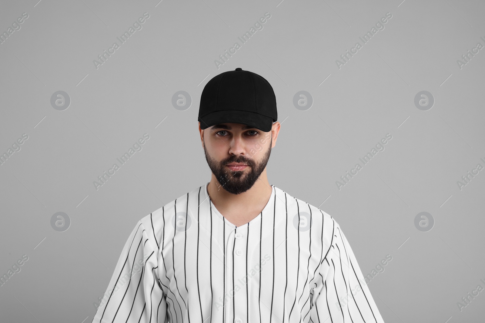 Photo of Man in stylish black baseball cap on light grey background