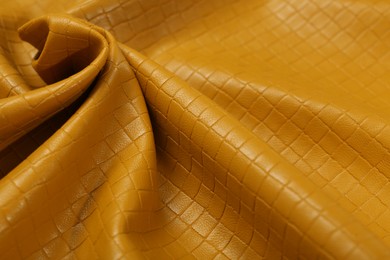 Photo of Beautiful yellow leather as background, closeup view