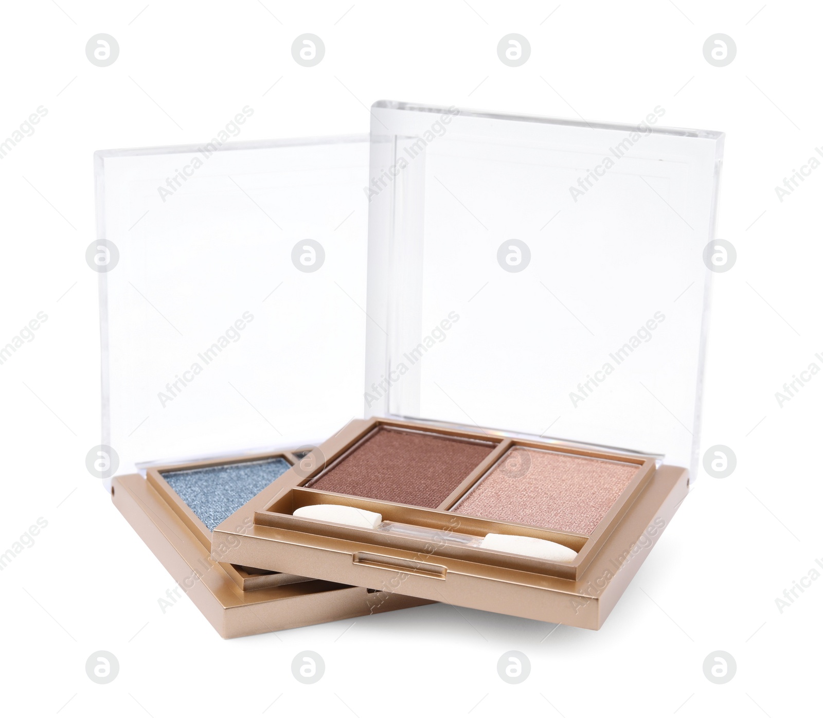 Photo of Beautiful eye shadow palettes with brushes isolated on white