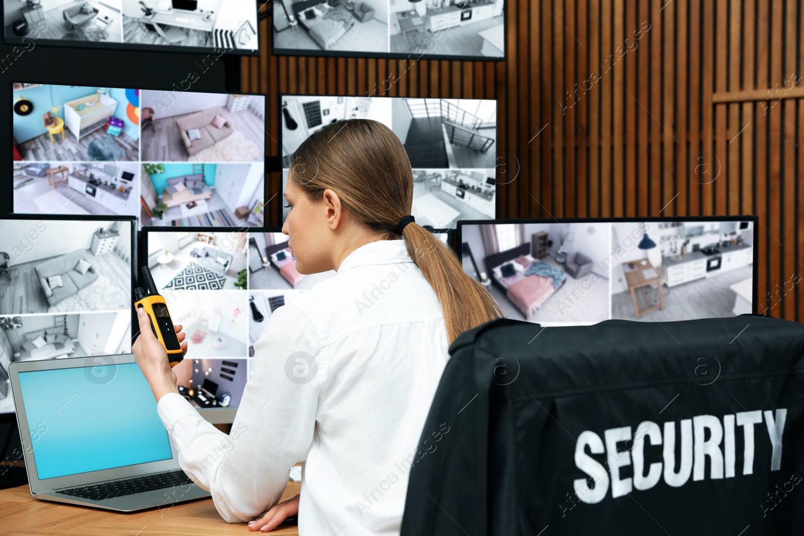 Photo of Security guard with portable transmitter at workplace