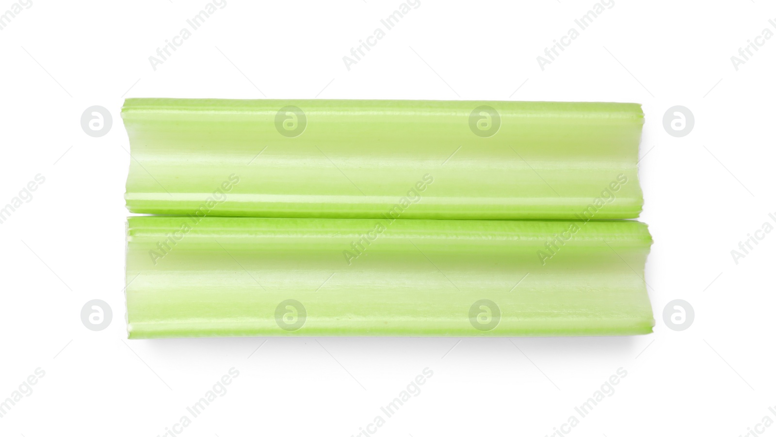 Photo of Fresh green cut celery isolated on white, top view