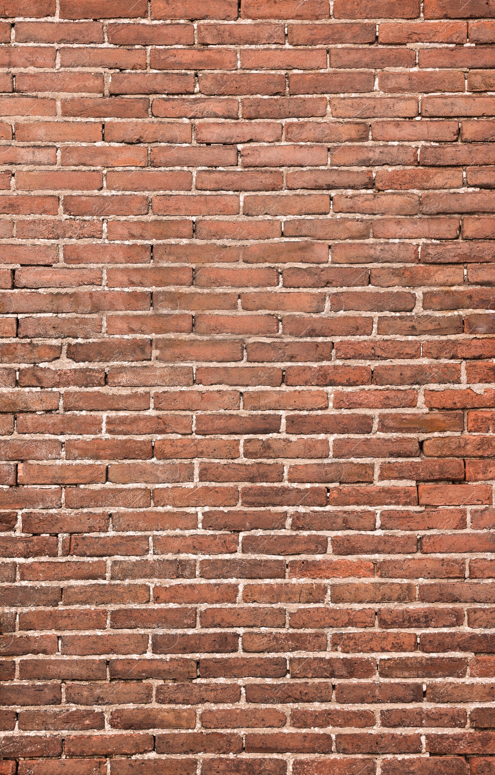 Photo of Texture of old red brick wall as background