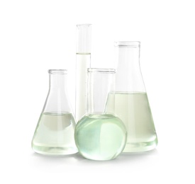 Laboratory glassware with liquid on white background. Chemical analysis