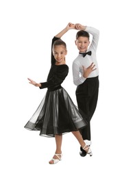 Photo of Beautifully dressed couple of kids dancing on white background