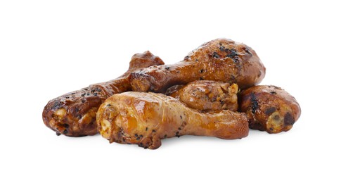 Photo of Pile of chicken legs glazed with soy sauce isolated on white