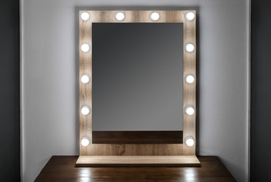 Photo of Beautiful mirror in modern makeup room