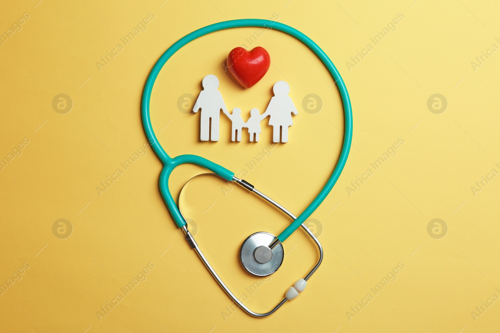 Photo of Flat lay composition with heart, stethoscope and family figure on color background. Life insurance concept