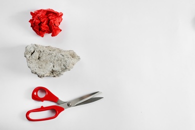 Photo of Rock, paper and scissors on white background, top view