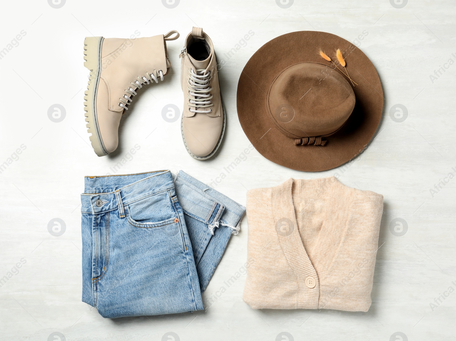 Photo of Flat lay composition with stylish boots on white background