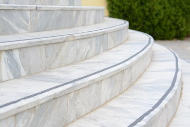 Photo of Tiled stairs outdoors, closeup view. Entrance design