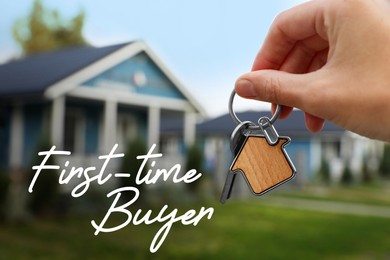 First-time buyer. Woman holding house keys outdoors, closeup