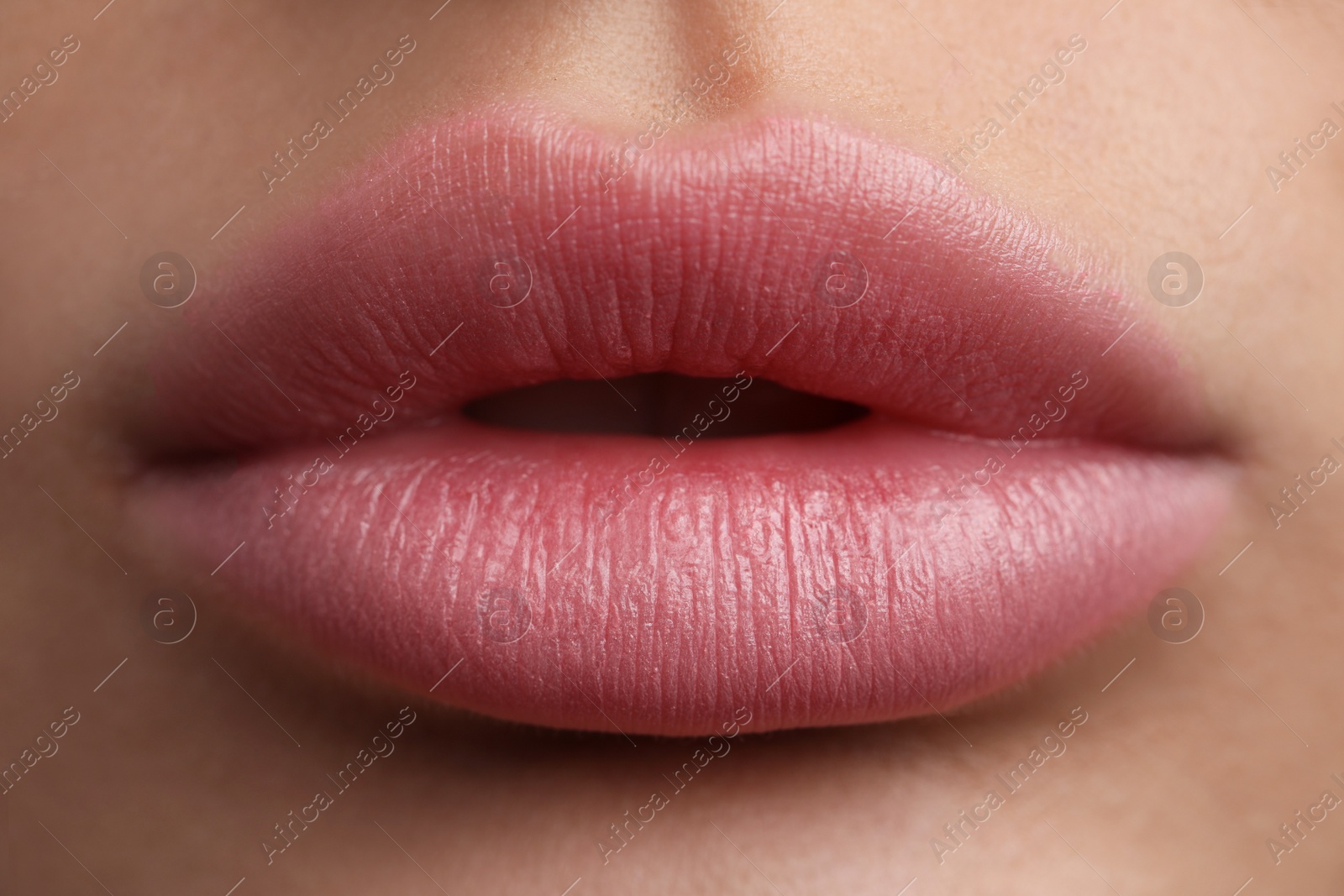 Photo of Young woman with beautiful lips, closeup view
