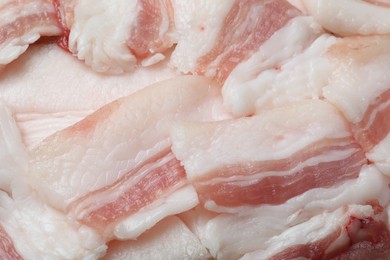 Slices of tasty salt pork as background, top view