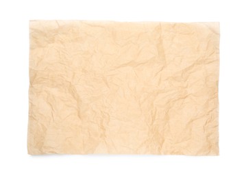 Photo of Sheet of crumpled brown baking paper on white background, top view