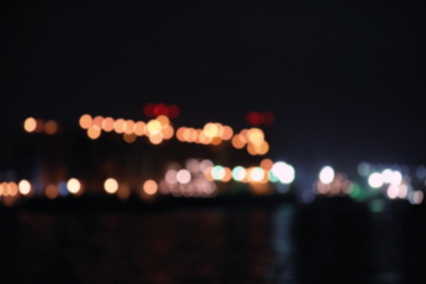 Photo of Blurred view of port at night. Bokeh effect