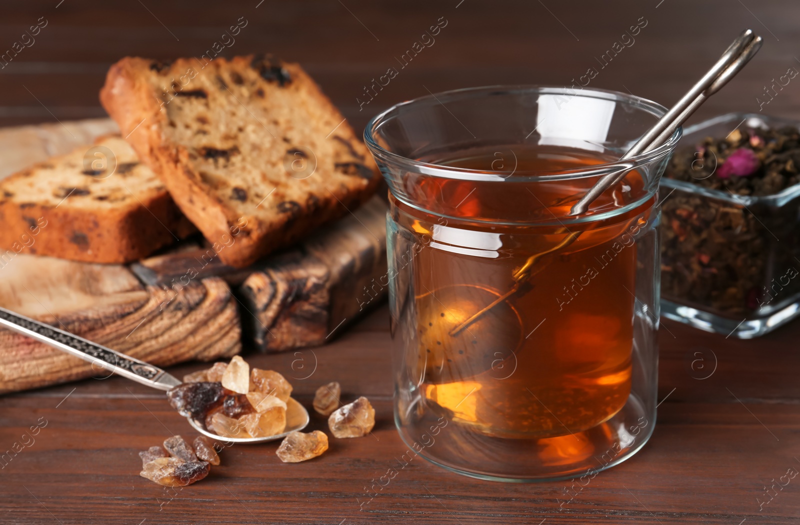 Photo of Composition with hot aromatic tea on wooden background